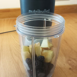 Making a smoothie with foraged blackberries